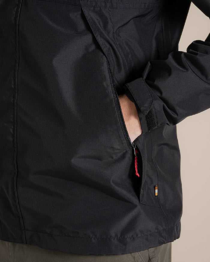 Black coloured Craghoppers Ossus Jacket on beige background #colour_black