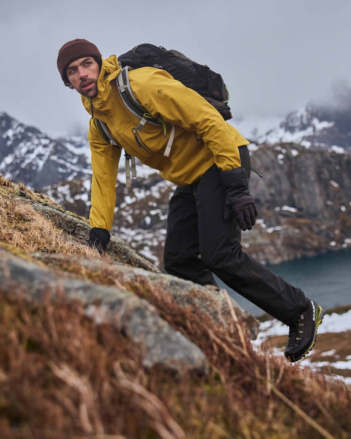 Black colour Craghoppers Steall Pro Thermo Waterproof Trouser on forest background #colour_black