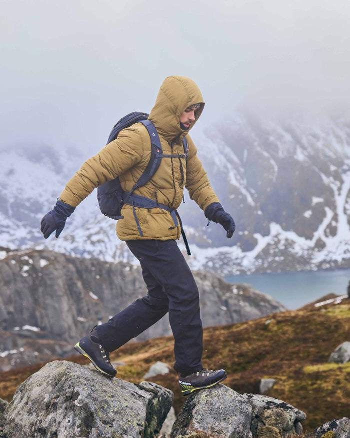 Black colour Craghoppers Steall Pro Thermo Waterproof Trouser on forest background #colour_black