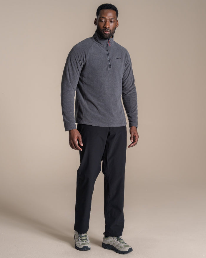 Black coloured Craghoppers Stefan Pro Waterproof Trouser on beige background #colour_black