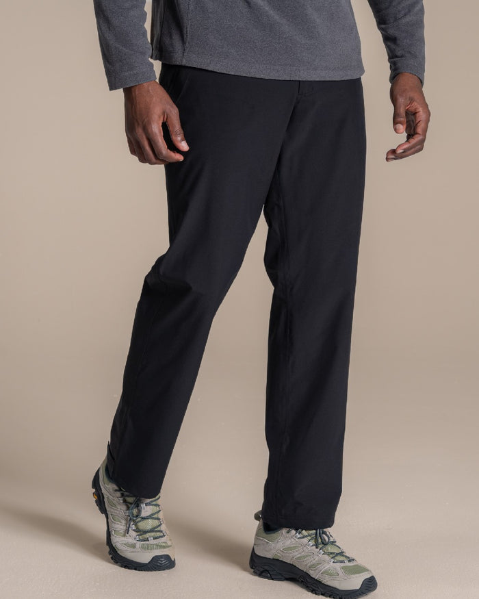 Black coloured Craghoppers Stefan Pro Waterproof Trouser on beige background #colour_black