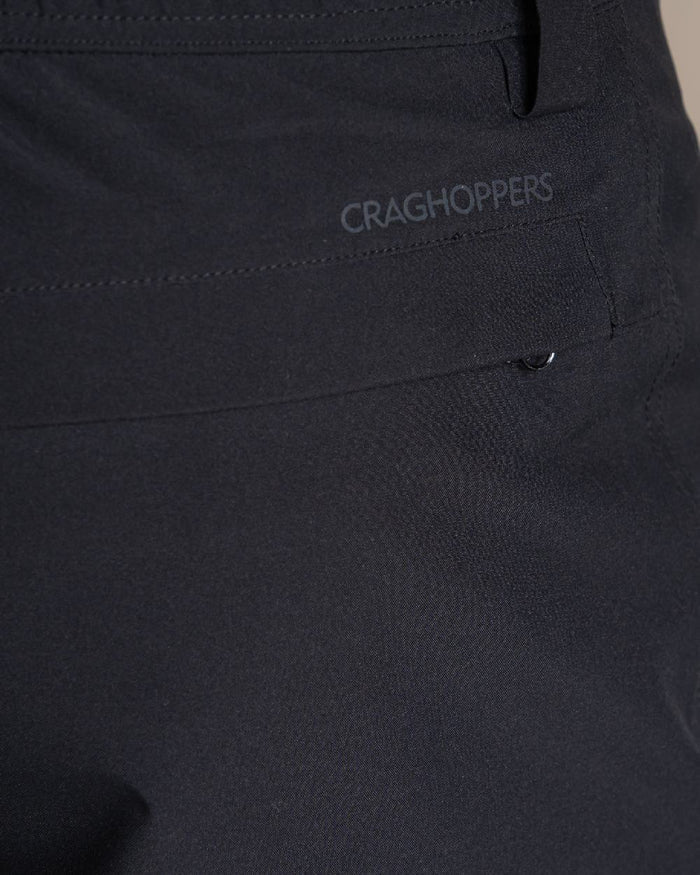 Black coloured Craghoppers Stefan Pro Waterproof Trouser on beige background #colour_black