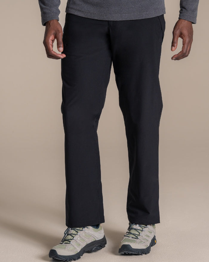 Black coloured Craghoppers Stefan Pro Waterproof Trouser on beige background #colour_black