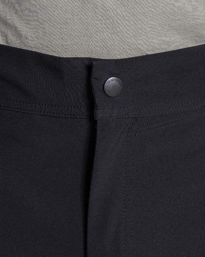Black coloured Craghoppers Stefan Pro Waterproof Trouser on beige background #colour_black