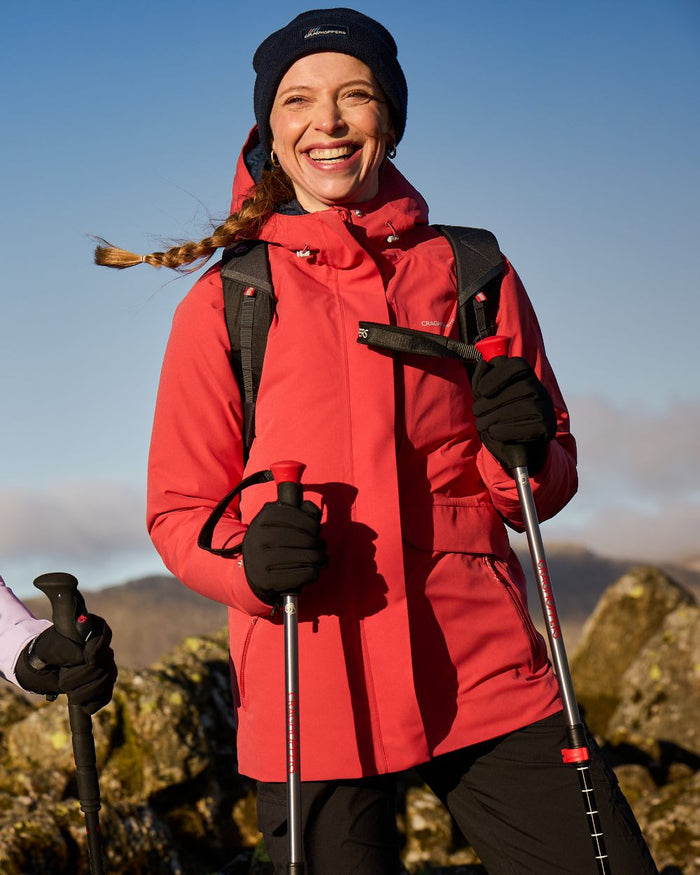 Compote Red coloured Craghoppers Womens Caldbeck II Waterproof Jacket on mountain background #colour_compote-red