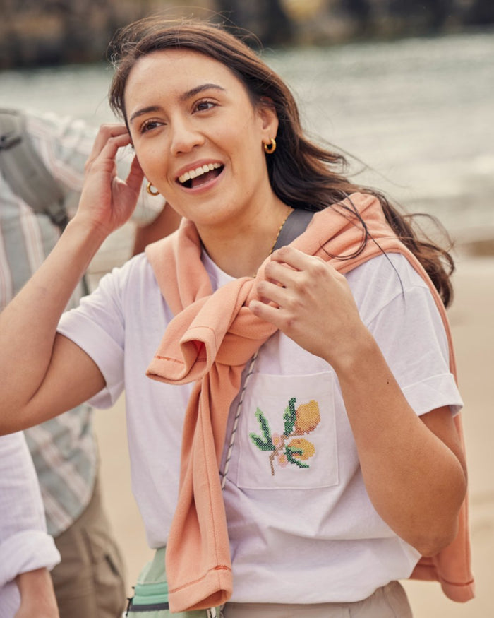 White coloured Craghoppers Womens Maya Short Sleeved T-Shirt on outdoor background #colour_white