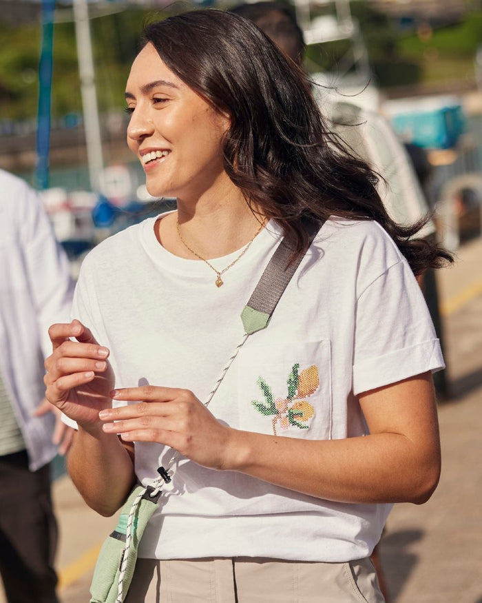 White coloured Craghoppers Womens Maya Short Sleeved T-Shirt on outdoor background #colour_white