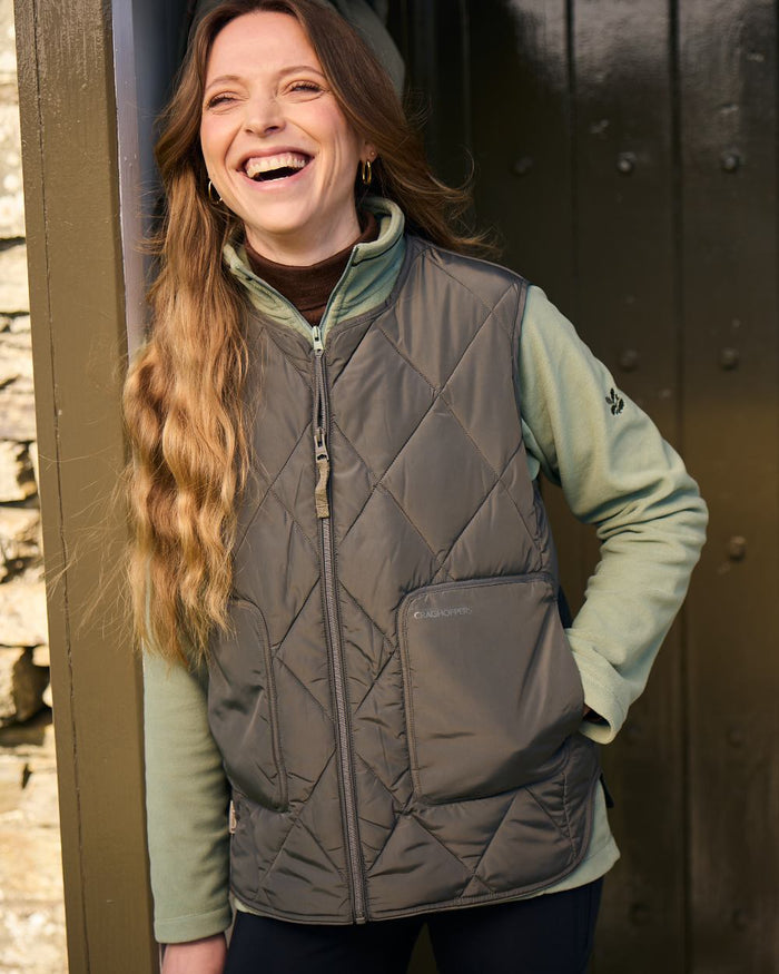 Nori Green coloured Craghoppers Womens National Trust Borage Vest on outdoor background #colour_nori-green