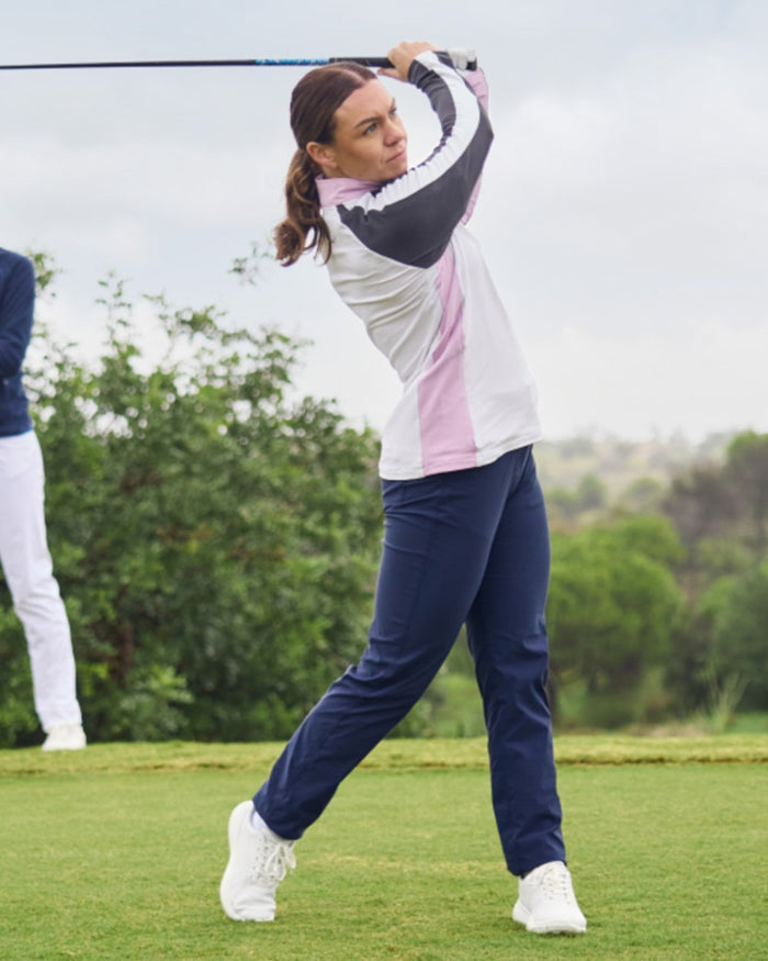 Blue Navy coloured Craghoppers Womens Nosilife Milla Golf Trousers on grass background #colour_blue-navy