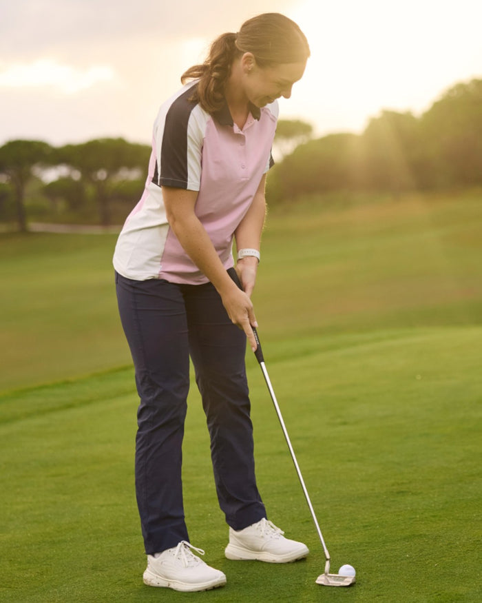 Blue Navy coloured Craghoppers Womens Nosilife Milla Golf Trousers on grass background #colour_blue-navy