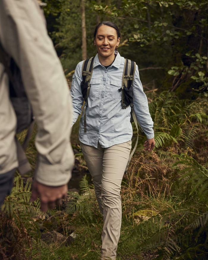 Soft Mushroom coloured Craghoppers Womens NosiLife Pro Trousers III on forest background #colour_soft-mushroom