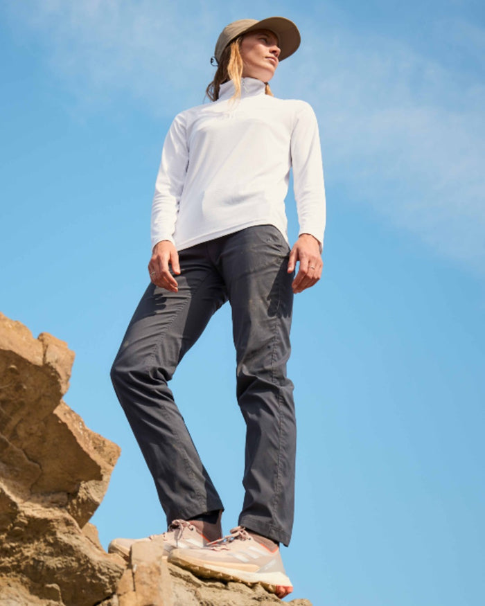 Dark Iron coloured Craghoppers Womens NosiLife Rif Stretch Cargo Trousers on mountain background #colour_dark-iron