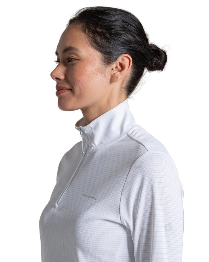 White coloured Craghoppers Womens NosiLife SolarShield+ Half Zip Top on white background #colour_white