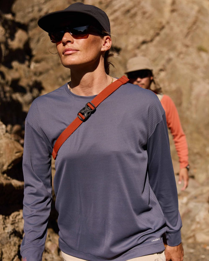 Anthracite coloured Craghoppers Womens NosiLife SolarShield+ Long Sleeved T-Shirt on mountain background #colour_anthracite