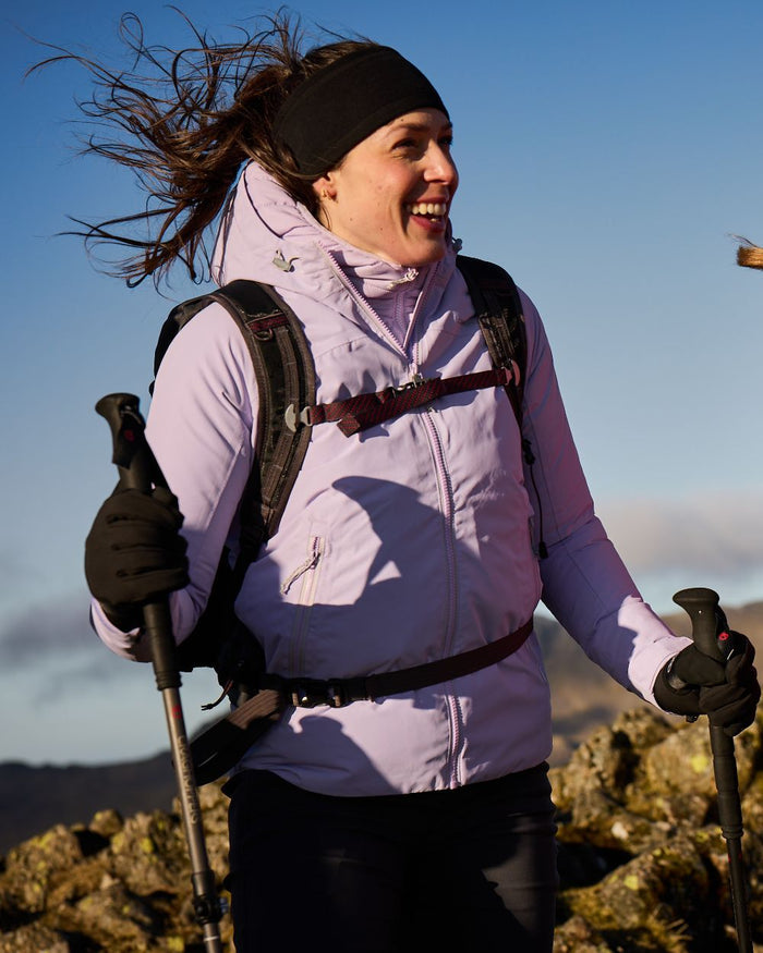 Parma Violet coloured Craghoppers Womens Solla Waterproof Jacket on mountain background #colour_parma-violet