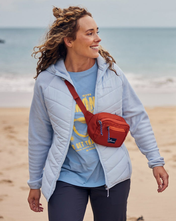 Nimbus Blue coloured Craghoppers Womens Zayas Hybrid Insulating Jacket on sea background #colour_nimbus-blue