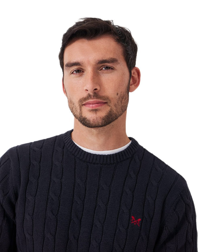 Navy Coloured Crew Clothing Mens Oarsman Cable Knit Organic Cotton Crew Neck Jumper on white background #colour_navy