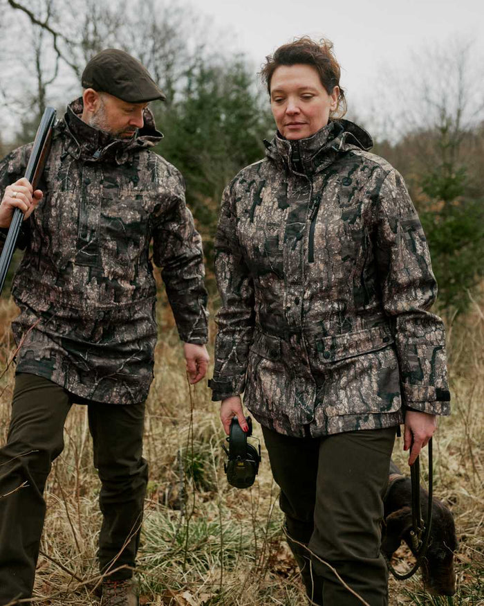 Realtree Timber Coloured Deerhunter Lady Gabby Jacket on forest background #colour_realtree-timber