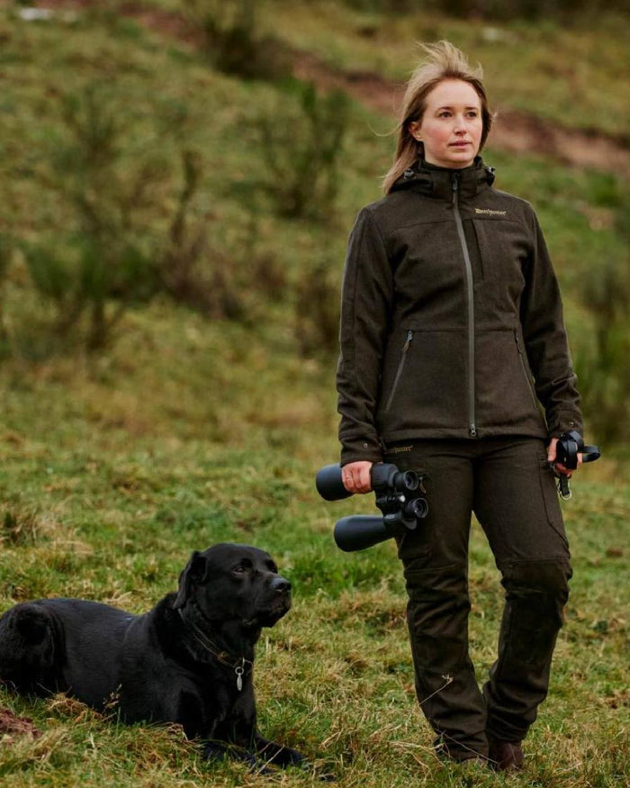 Loden Wood Deerhunter Lady Tatra Trousers on grassy background #colour_loden-wood