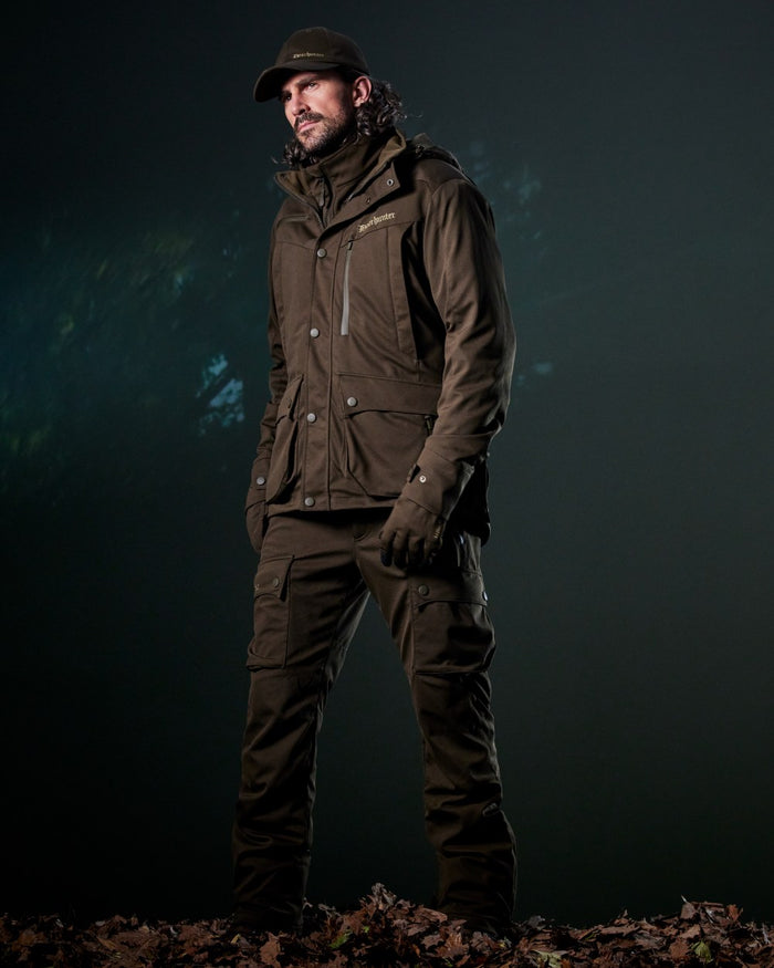 Art Green coloured Deerhunter Mens Muflon Pro Light Jacket on forest background #colour_art-green