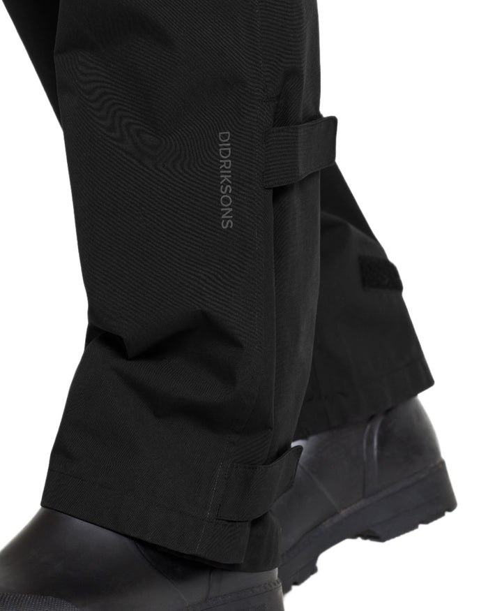 Black coloured Didriksons Mens Grit Rain Pants on white background #colour_black