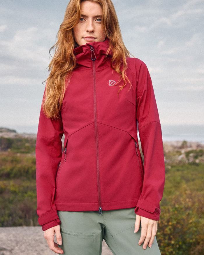 Spring Red coloured Didriksons Womens Petra Jacket on mountain background #colour_spring-red