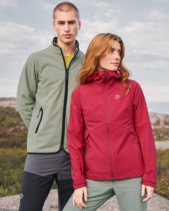 Spring Red coloured Didriksons Womens Petra Jacket on mountain background #colour_spring-red