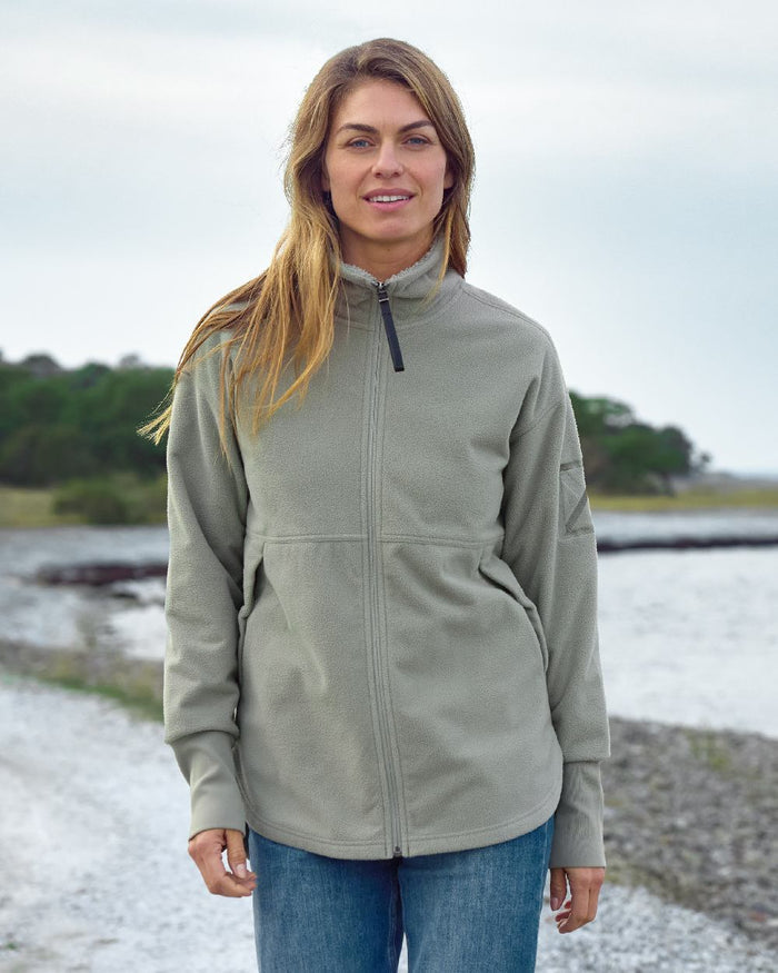 Wilted Leaf coloured Didriksons Womens Ronja Full Zip Sweater on coastal background #colour_wilted-leaf