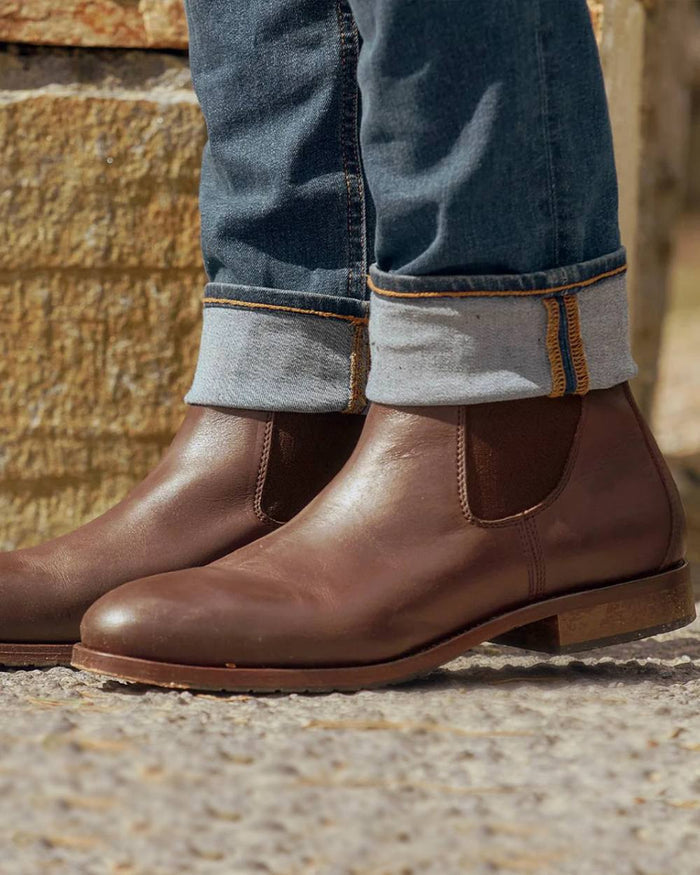 Mahogany coloured Dubarry Kerry Leather Soled Boots on blurry background #colour_mahogany