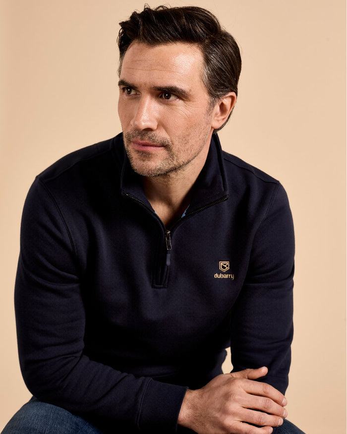 Navy coloured Dubarry Mens Boyce Zip Neck Sweater on indoor background #colour_navy