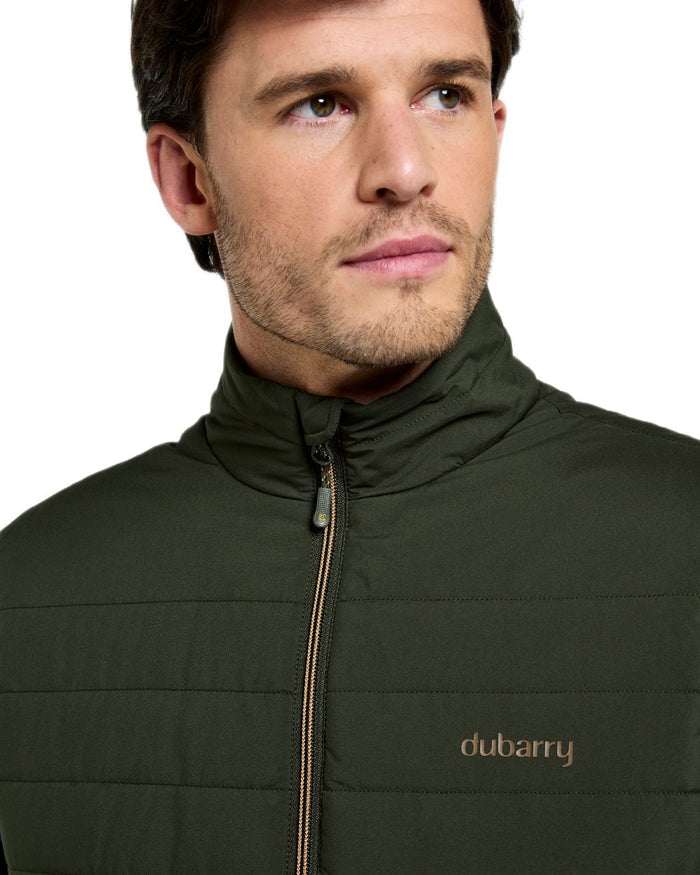 Olive coloured Dubarry Mens Solent Lightweight Hybrid Gilet on white background #colour_olive