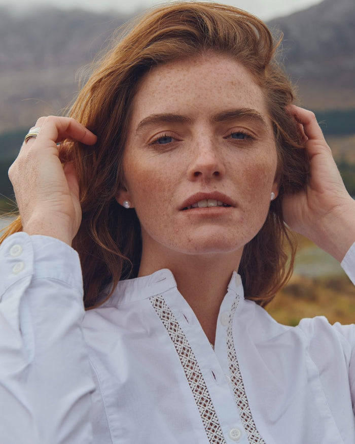 White Coloured Dubarry Womens Waterlily Mandarin Collar Shirt on blurry background #colour_white