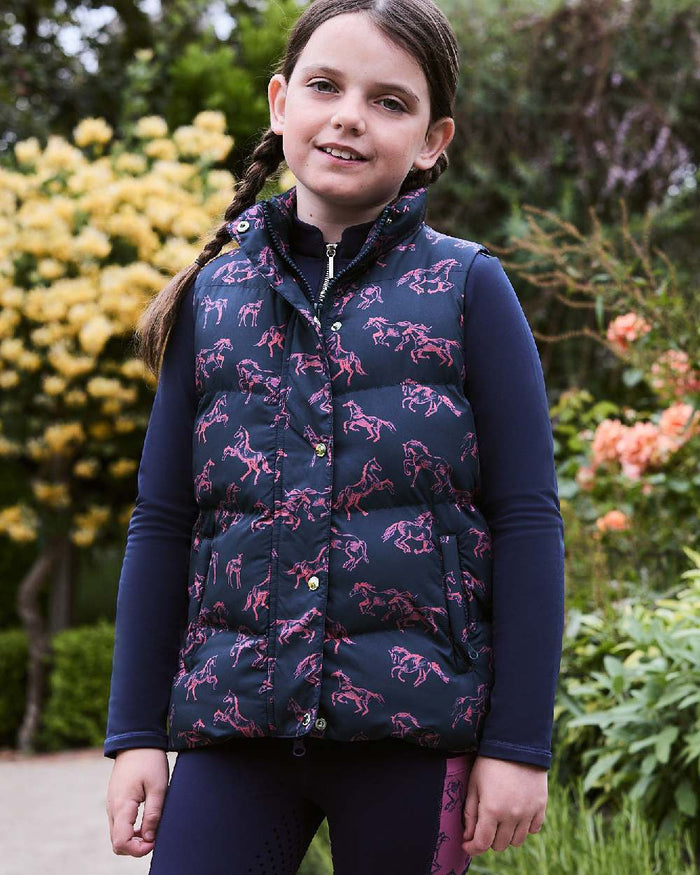 Navy Frolicking Horses coloured Dublin Childrens Patrice Everyday Puffer Vest on Plants background #colour_navy-frolicking-horses
