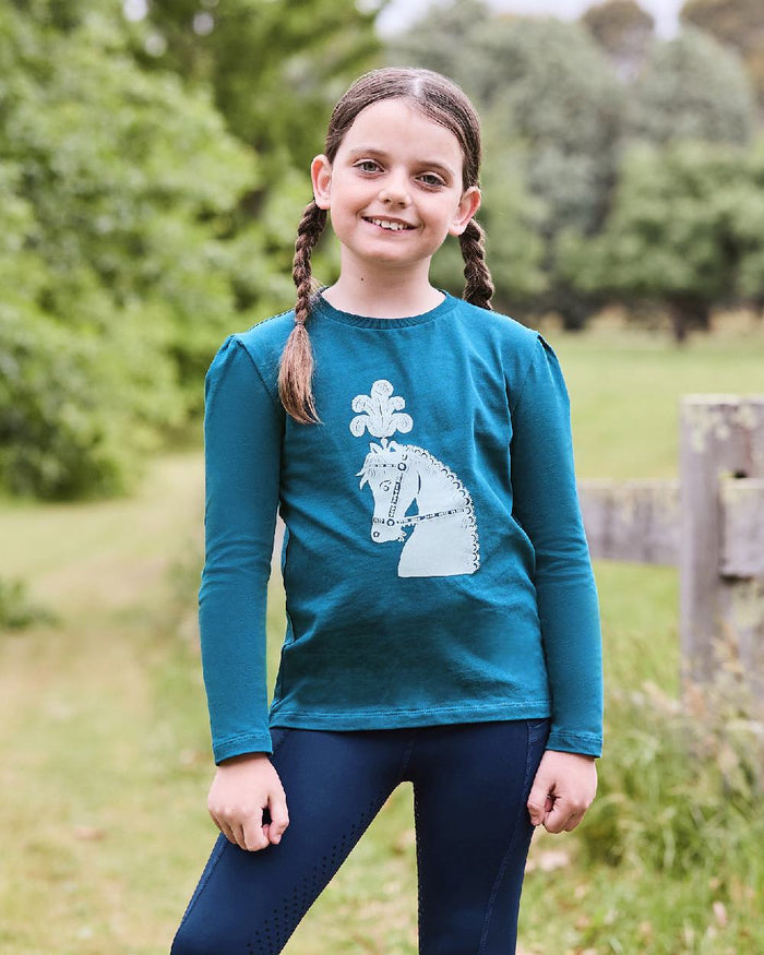 Legion Blue Pony Silhouette coloured Dublin Childrens Poppy Puff Sleeve Tee on blurry background #colour_legion-blue-pony-silhouette