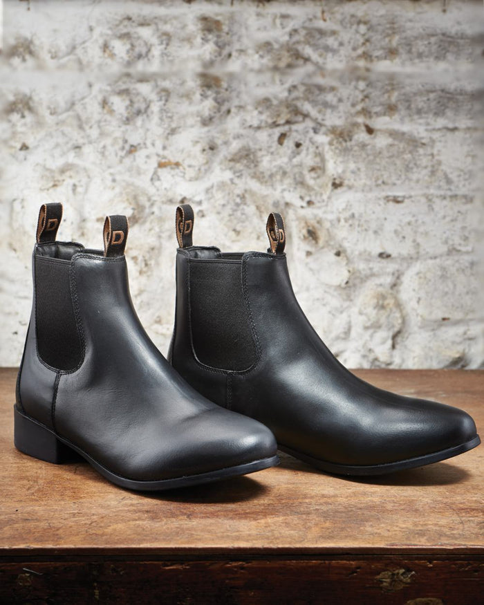 Black Coloured Dublin Foundation Jodhpur Boots II on wall background #colour_black