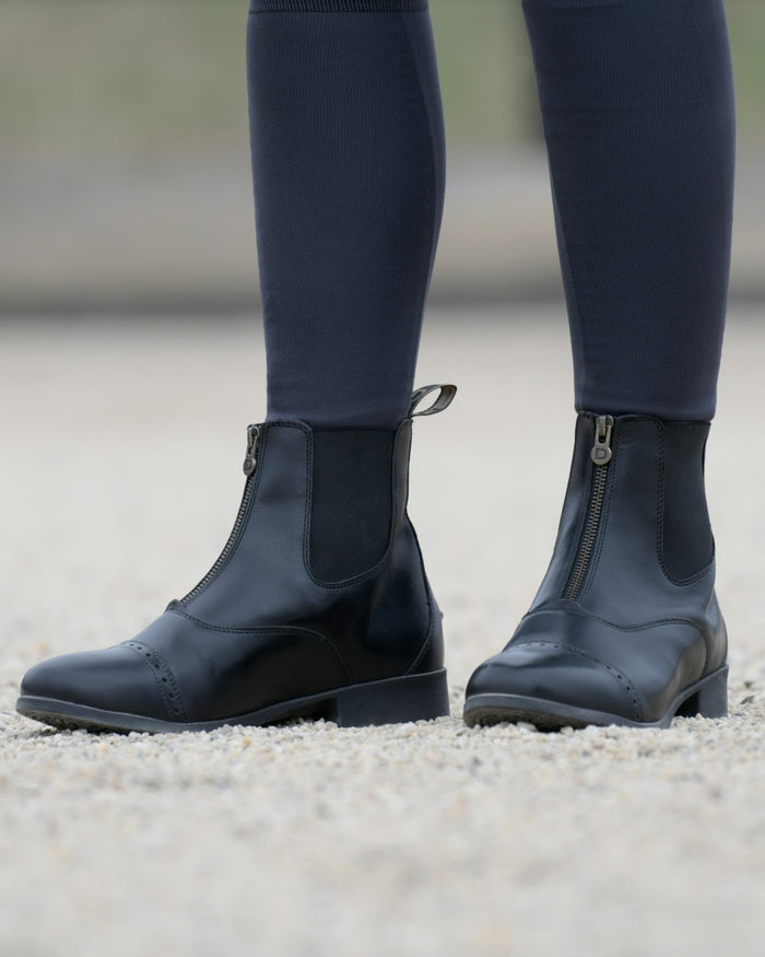 Black Coloured Dublin Foundation Zip Paddock Boots II on street background #colour_black