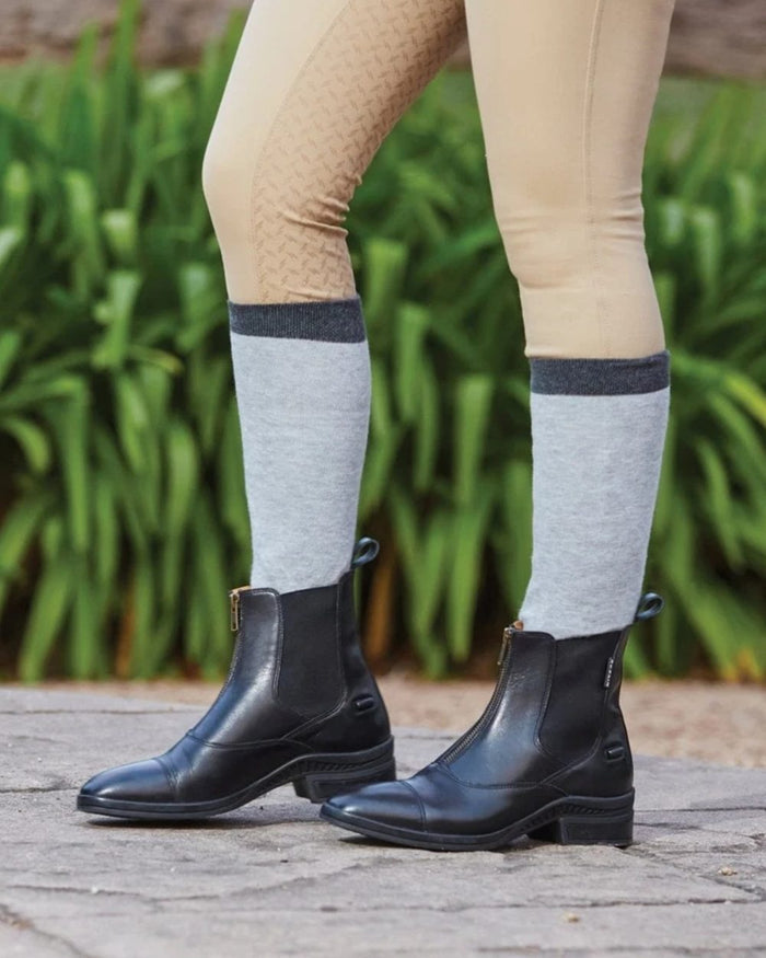 Black coloured Dublin Paramount Zip Paddock Boots on garden background #colour_black