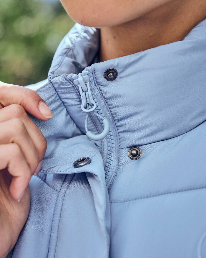 Blue Fog coloured Dublin Womens Puffer Body Warmer on blurry background #colour_blue-fog