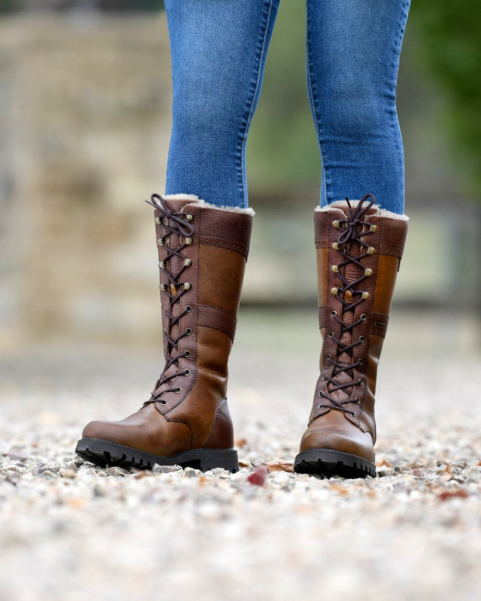 Brown Coloured Dublin Yukon Boots on blurry background #colour_brown