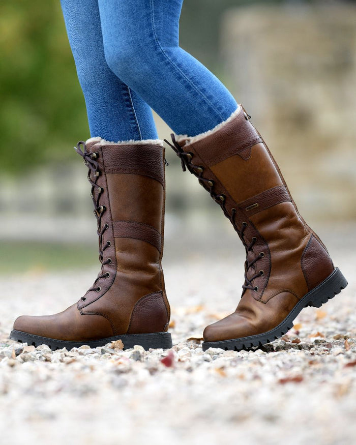 Brown Coloured Dublin Yukon Boots on blurry background #colour_brown