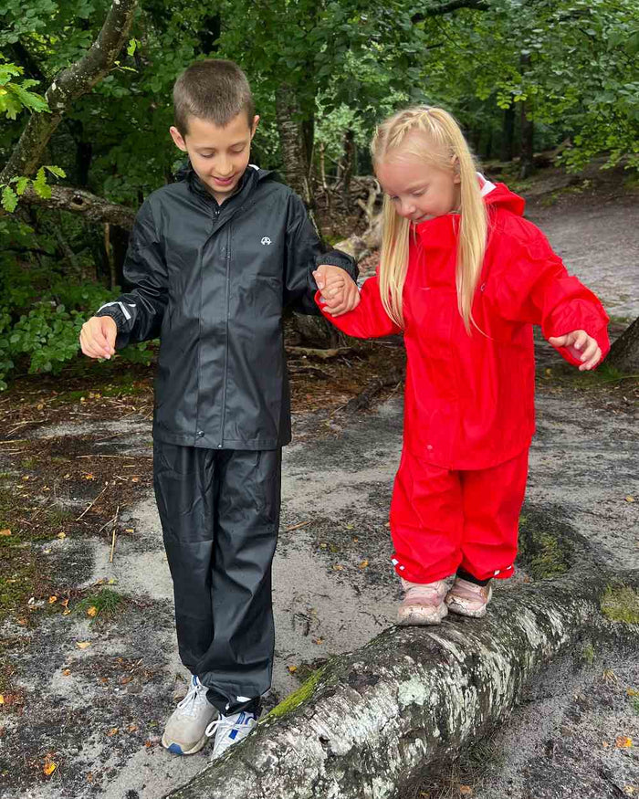 Black Coloured Elka Childrens Rain Set on forest background #colour_black
