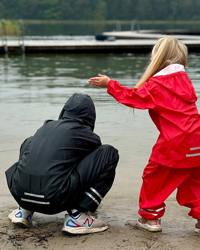 Black Coloured Elka Childrens Rain Set on lake background #colour_black