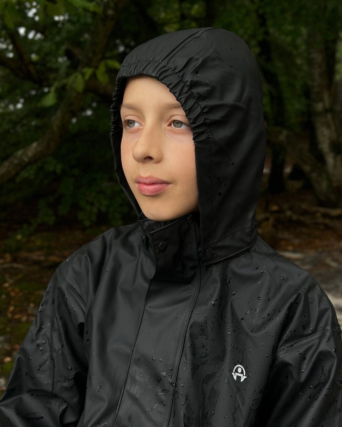 Black Coloured Elka Childrens Rain Set on forest background #colour_black