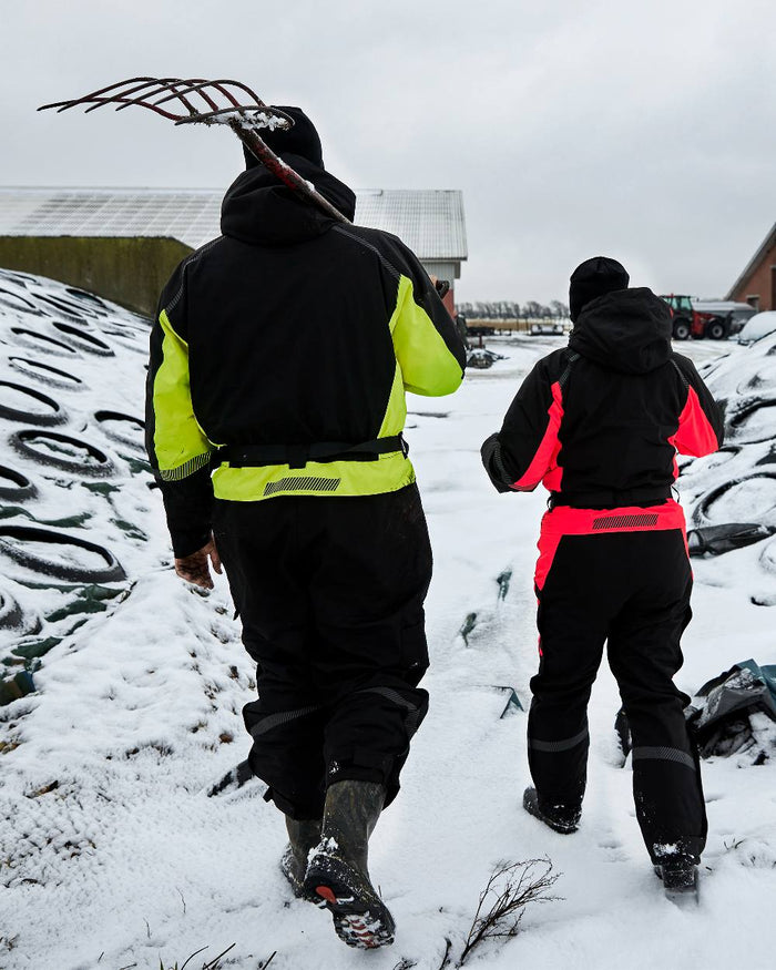 Black Fluorescent Yellow Coloured Elka Mens Working Xtreme Winter Thermal Coverall With Recycled Padding on snow background #colour_black-fluorescent-yellow