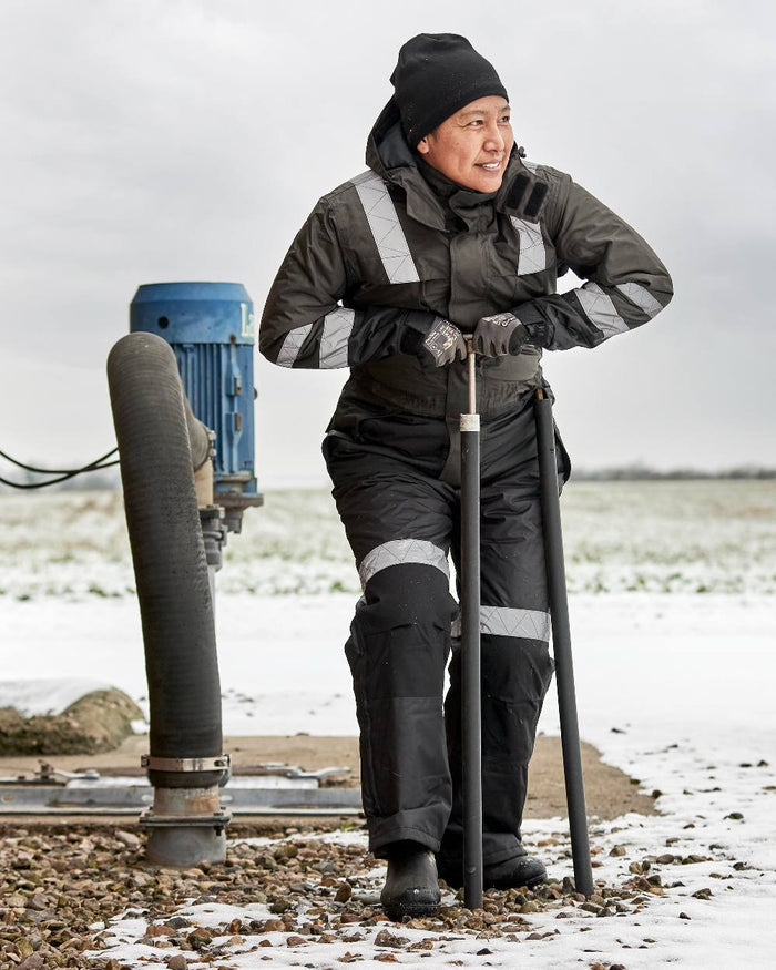 Grey Black Coloured Elka Womens Working Xtreme Winter Thermal Coverall on snow background #colour_grey-black