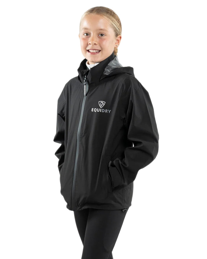 Black coloured Equidry Childrens Nimbus Pack Away Jacket With Stowaway Hood on white background #colour_black