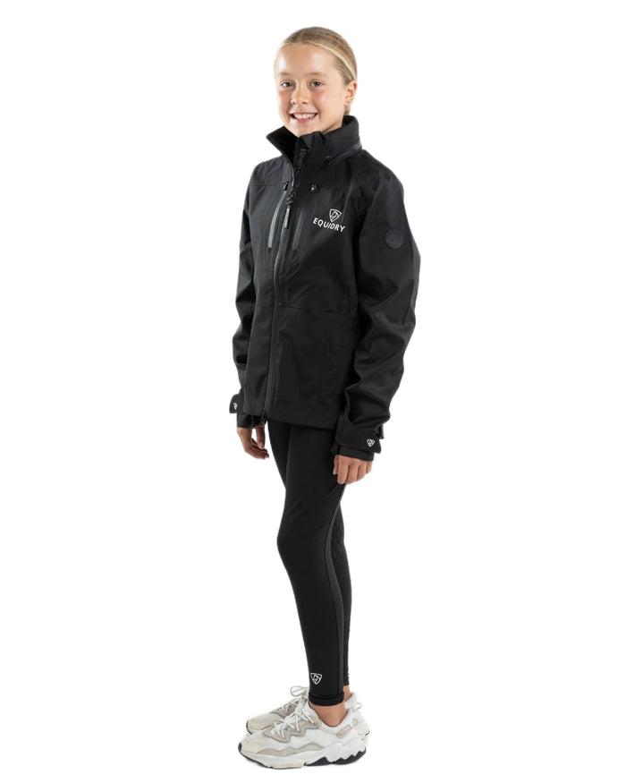 Black coloured Equidry Childrens Varsha Waterproof Jacket on white background #colour_black