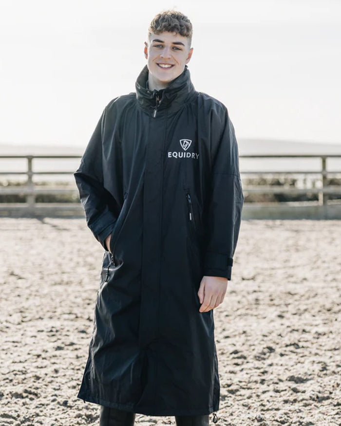 Black coloured Equidry Mens Equimac Evolution Jacket on outdoor background #colour_black