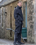 Black coloured Equidry Mens Fleece Lined Waterproof Trousers on outdoor background #colour_black