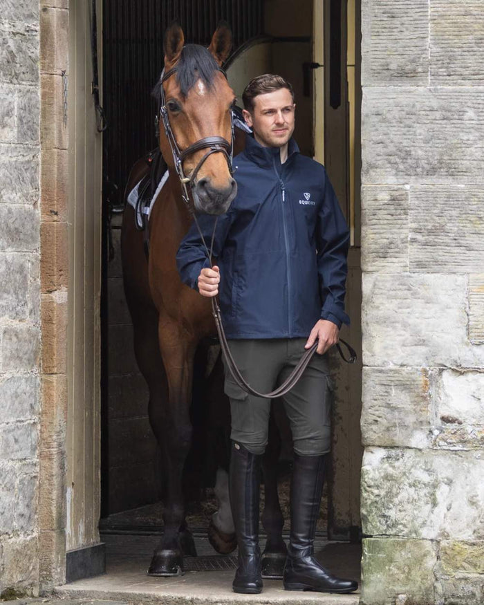 Navy coloured Equidry Mens Nimbus Pack Away Jacket With Stowaway Hood on outdoor background #colour_navy